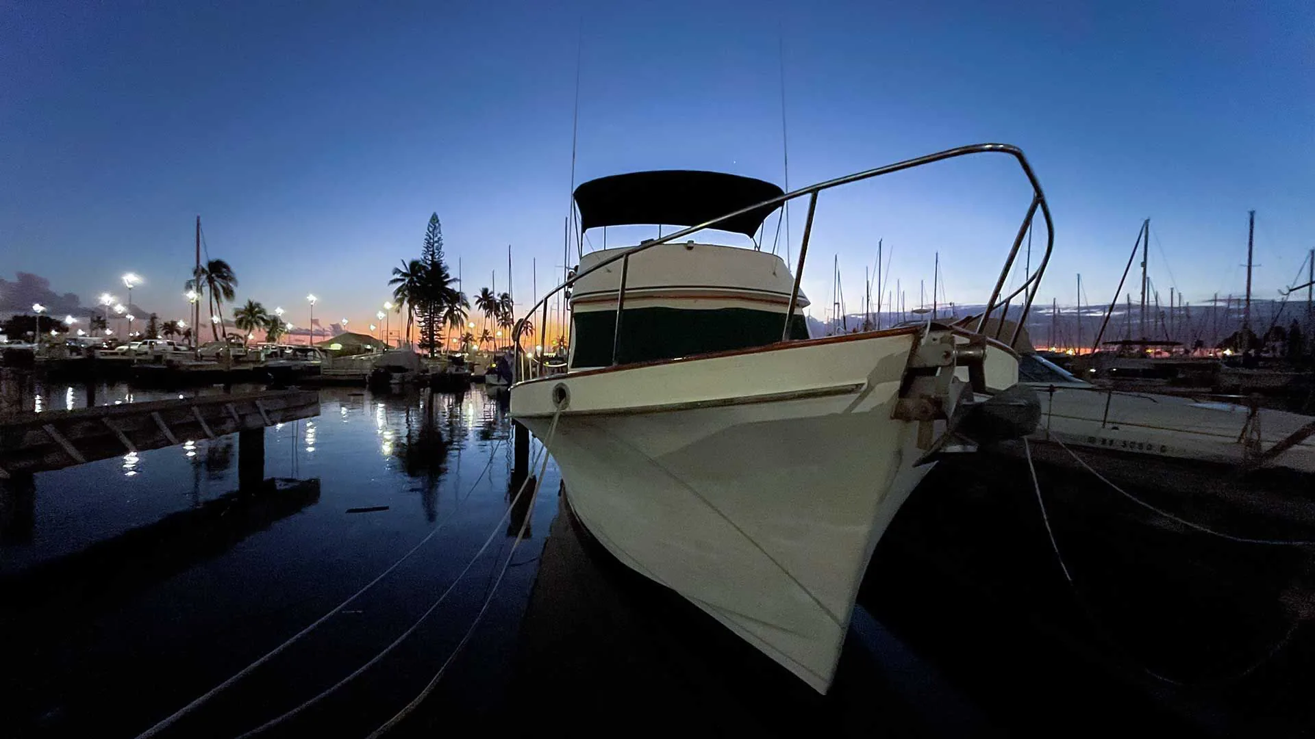 Ocean Adventures Hawaii's boat at Ala Wai Harbor at dusk