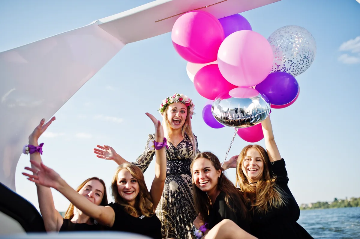 A group celebrating aboard a private yacht charter off Waikiki