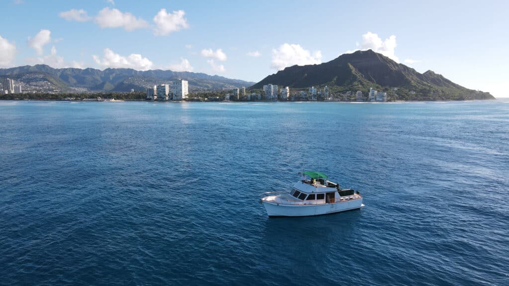 Guests sipping drinks during an afternoon sail